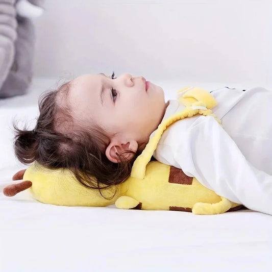 Baby lying on the bed with the bee head protector cushioning the head