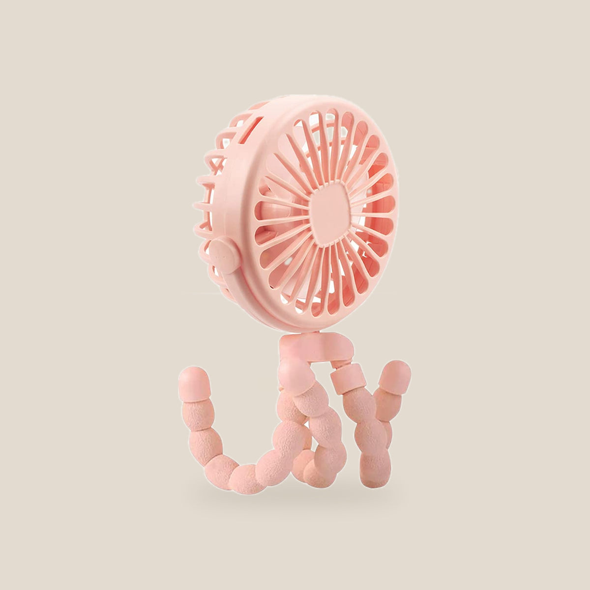 Pink clip on pram fan standing on its bendy legs