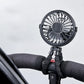 Black pram fan clipped to a pushchair handlebar